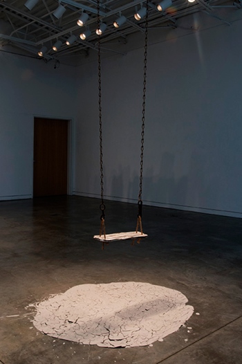 Empty, rusty chains and empty ceramic swing by Susan Mollet 