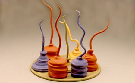  colored oil cans by Susan Mollet