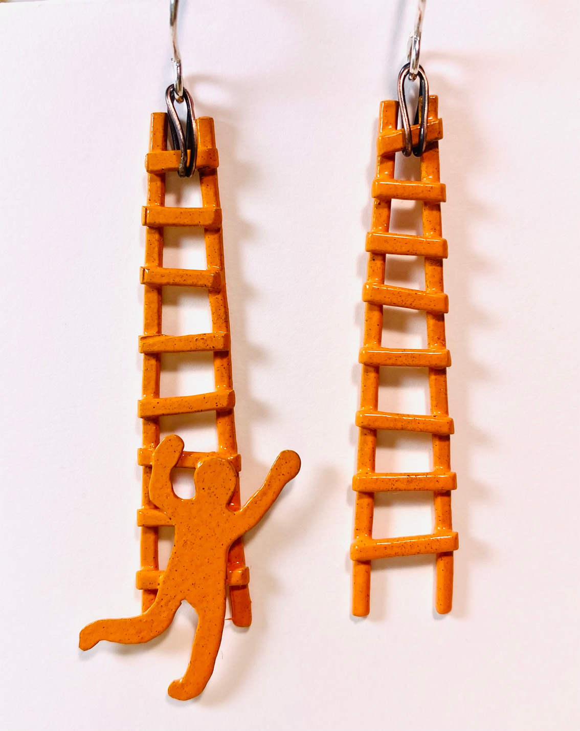 metal ladder earrings with person shape climing  by Susan Mollet